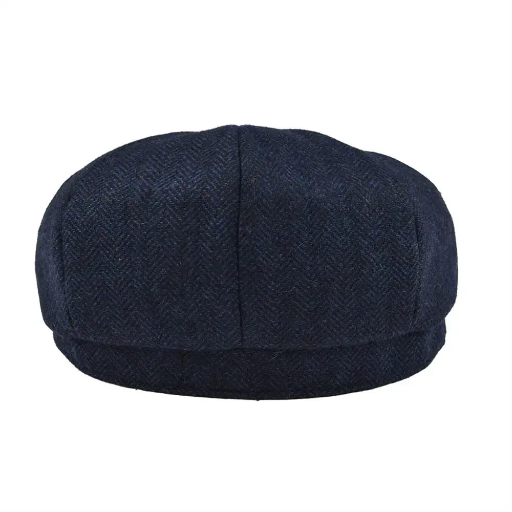 Dark blue tweed Gavroche cap with herringbone pattern, ideal for stylish outdoor wear.