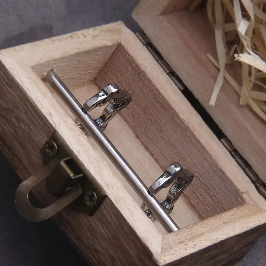 Inside view of a wooden box with a silver metal latch and decorative straw, showcasing a storage solution.