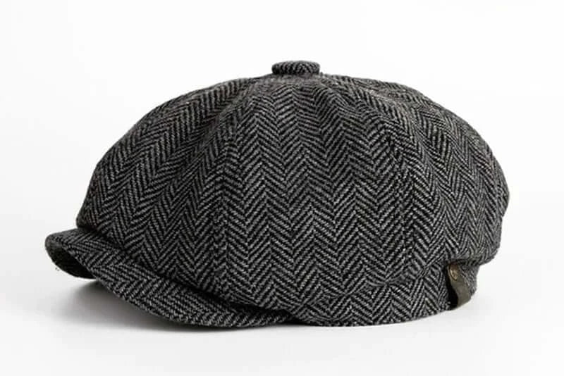 casquette gavroche en tissu à chevrons noir et gris, élégante et traditionnelle, style vintage.