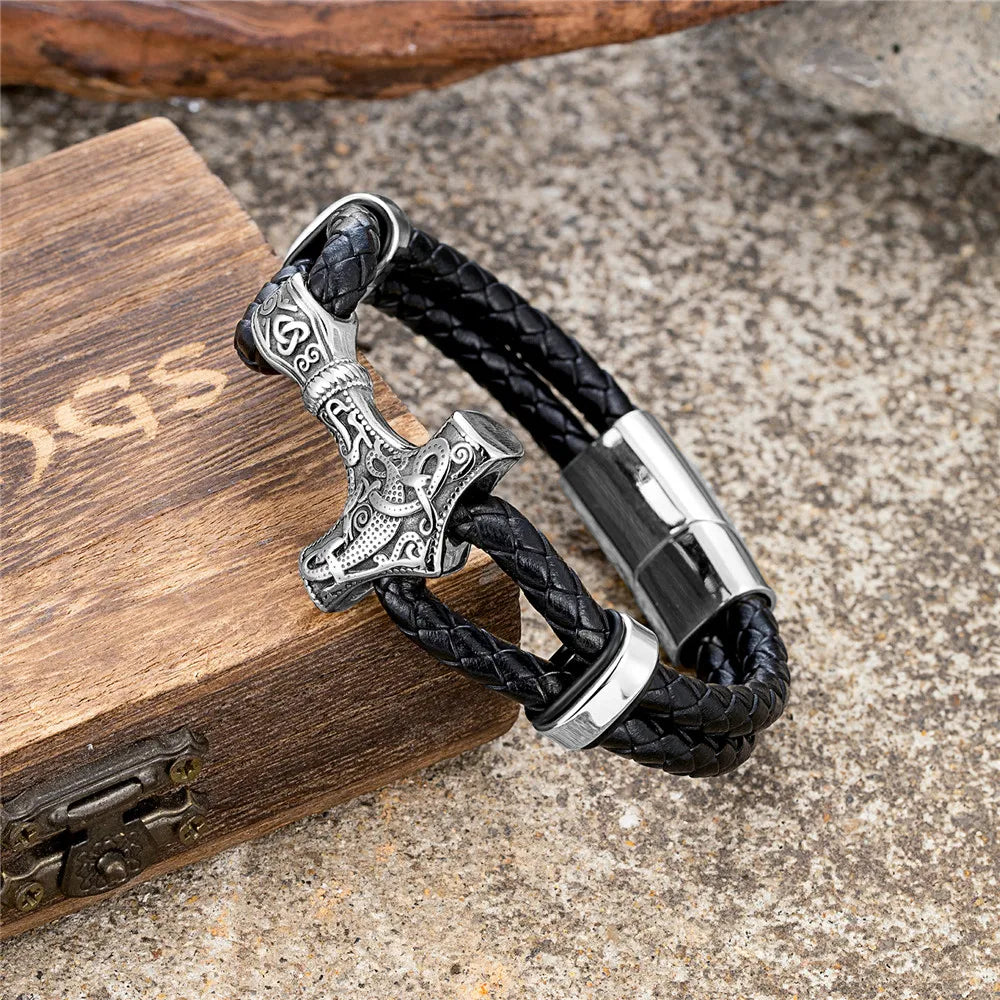 Leather bracelet featuring a silver Thor's hammer design, ideal for Viking-themed jewelry collectors.