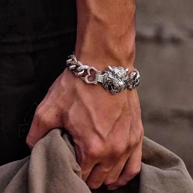 Stylish silver lion-head bracelet worn on a man's wrist, showcasing Celtic spirit and unique design.